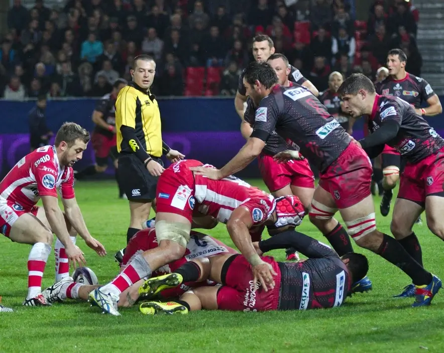 A group of rugby players in a ruck